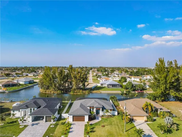 Aerial perspective of suburban area with a large body of water