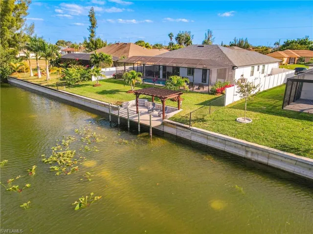 Dock with a water view and glass enclosure