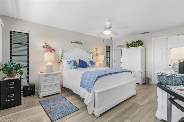 Bedroom with ceiling fan and light hardwood / wood-style floors