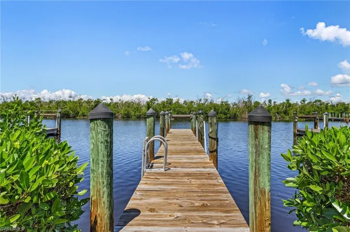 Dock area featuring a water view and sink