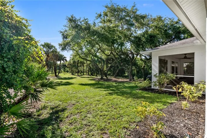 View of yard featuring ceiling fan