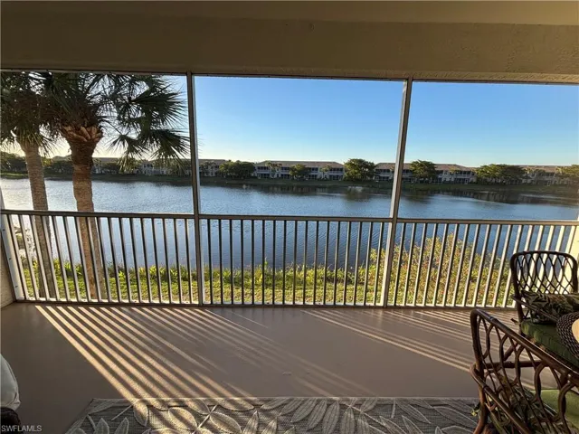 Unfurnished sunroom featuring a water view and a wealth of natural light