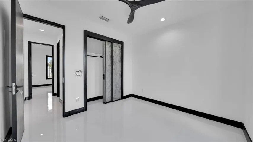 Unfurnished bedroom featuring recessed lighting, a closet, and ceiling fan