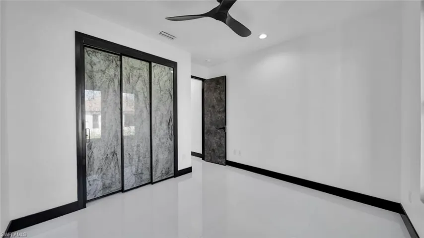 Empty room featuring recessed lighting and ceiling fan