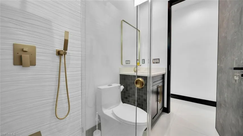 Full bathroom with vanity, a walk in shower, and light tile patterned floors