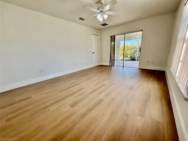 Spare room featuring ceiling fan and light hardwood / wood-style flooring
