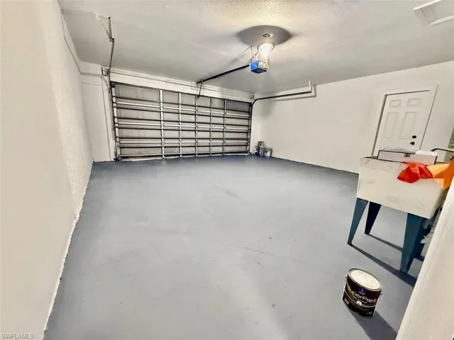 Garage featuring a garage door opener