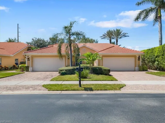 Mediterranean / spanish home with a garage