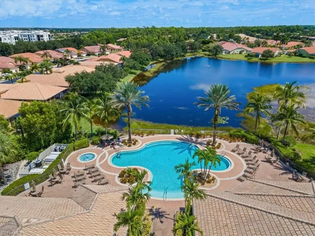 View of swimming pool featuring a patio and a water view