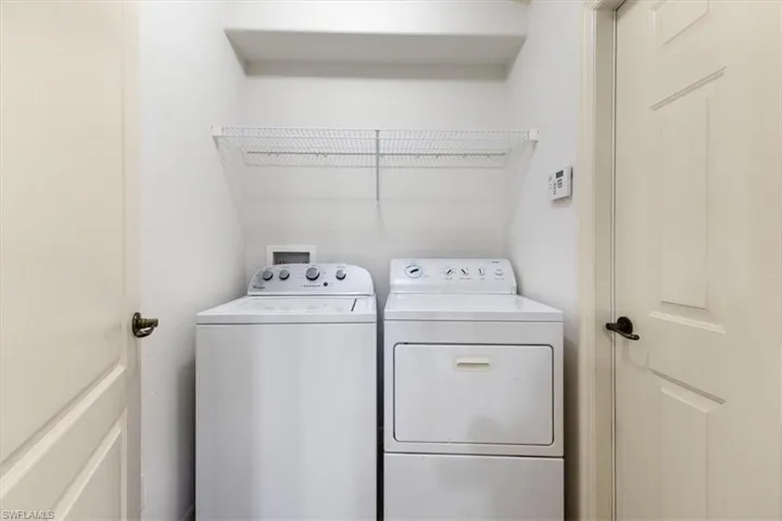 Clothes washing area with washing machine and clothes dryer