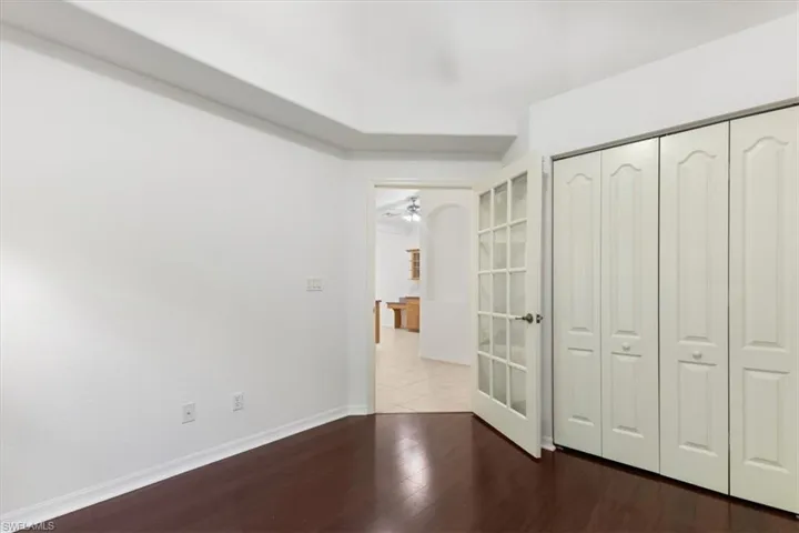 Unfurnished bedroom featuring a closet and hardwood / wood-style floors