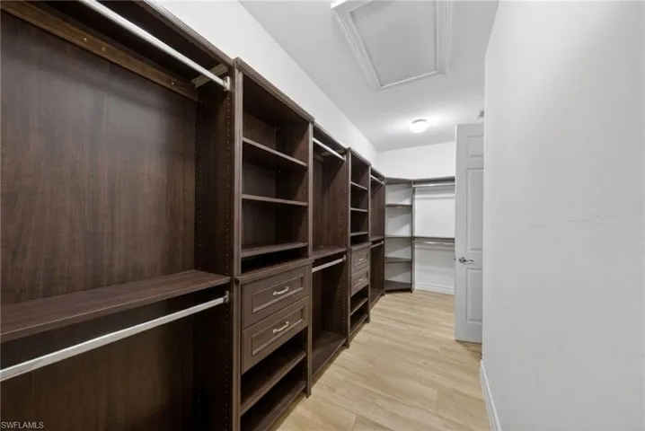 Spacious primary closet (virtually staged)