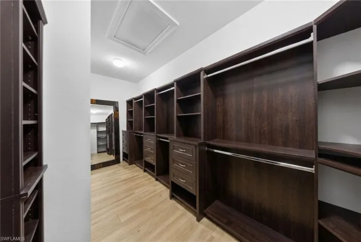 Spacious primary closet (virtually staged)