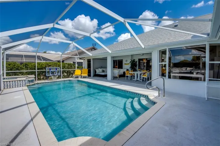 Integrated pool / spa featuring a patio, a sunroom, a lanai, and an outdoor hangout area