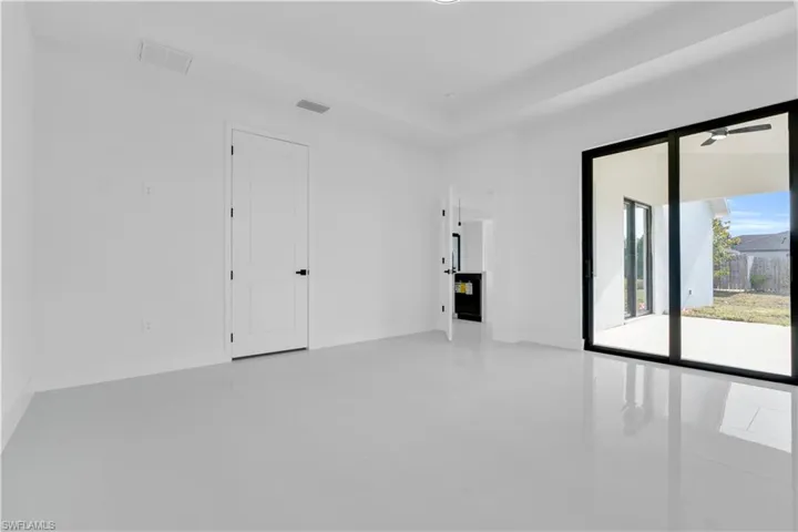 Unfurnished room with visible vents and tile patterned flooring