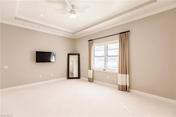 Owner's Suite with Tray Ceiling & Custom Draperies