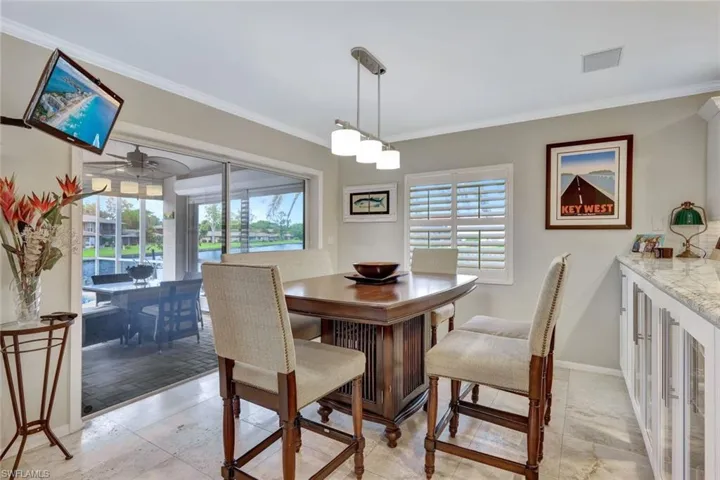 Eat-in Kitchen with view of the lanai and water.