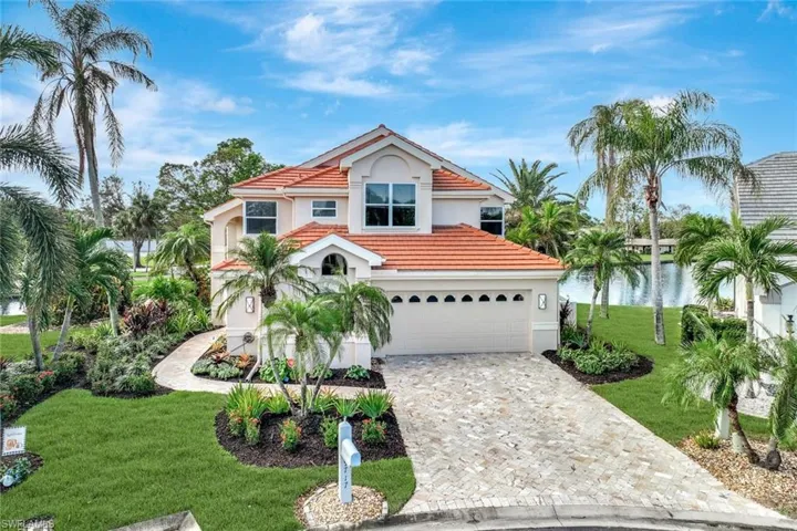 The Outstanding curb appeal of this meticulously maintained home begins at the custom travertine driveway with curving path through lush, professionally designed landscaping to the lovely etched glass entry door.