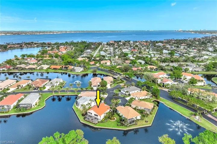 LOCATED on a quiet cul-de-sac in one of Fort Myers' loveliest gated, waterfront communities.