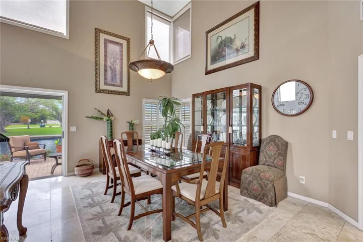 Formal dining in the Great Room boasting 17 ft ceilings.