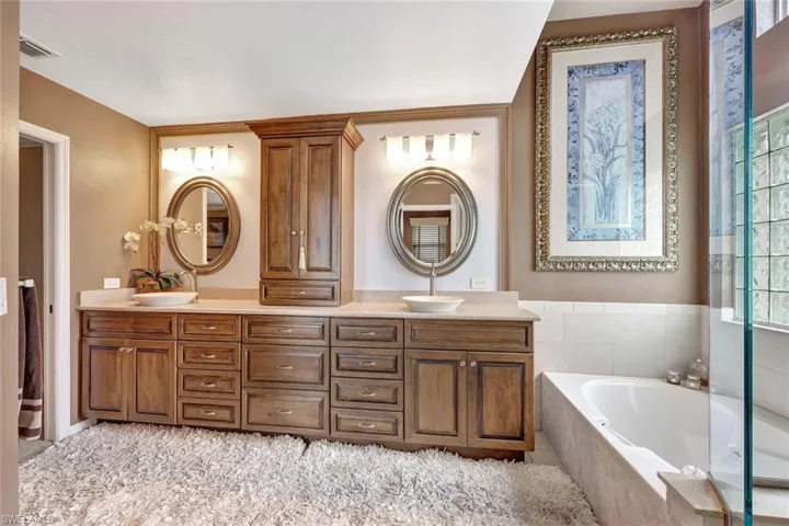 First floor Master Bathroom has a separate shower and soaking tub.
