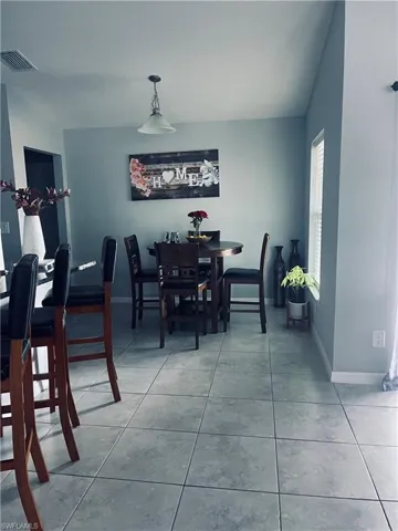 Dining room featuring light tile patterned floors