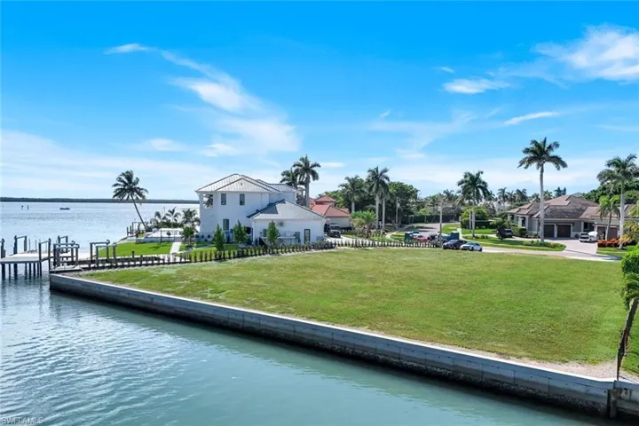 Large .54 acre lot with new seawall, ideal for building your dream home in the prestigious Estates section of Marco Island