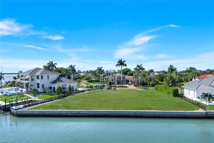 Large .54 acre lot with new seawall, ideal for building your dream home in the prestigious Estates section of Marco Island