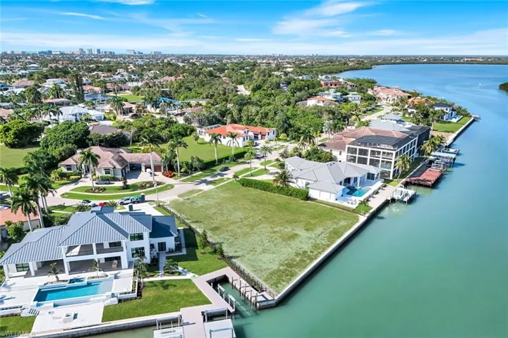 Large .54 acre lot with new seawall, ideal for building your dream home in the prestigious Estates section of Marco Island