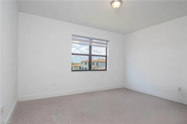 Unfurnished room with baseboards