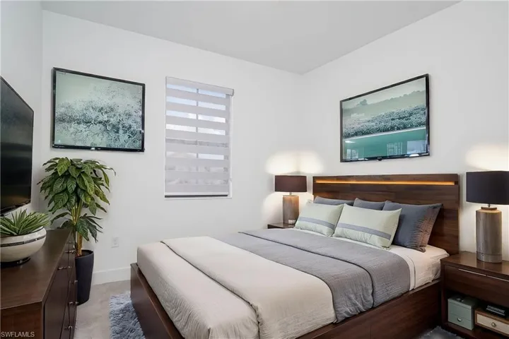 Bedroom with carpet floors and baseboards