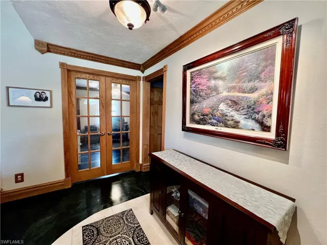 Entry showing French doors to third bedroom.