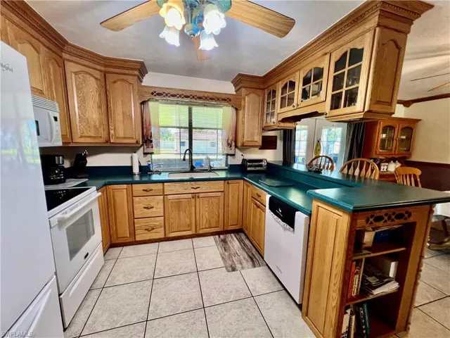 Kitchen with all appliances, breakfast bar and pantry.