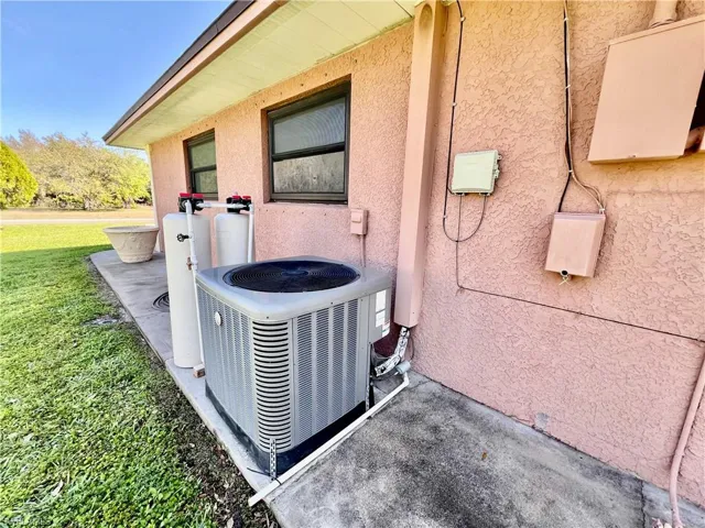 Exterior details featuring central air condition unit and stucco siding