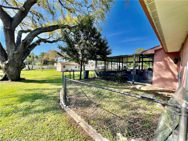 View of fenced dog run overlooking the HALF ACRE backyard.