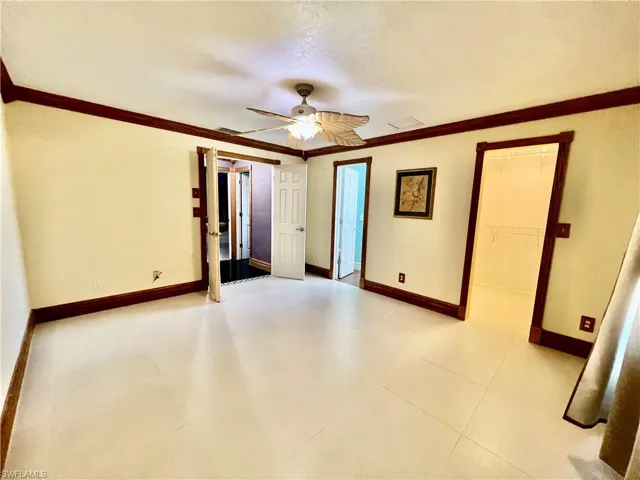 Primary bedroom with walk in closet and private ensuite bath.