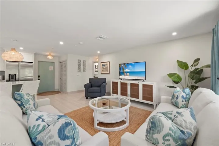Living room featuring light wood-type flooring and recessed lighting