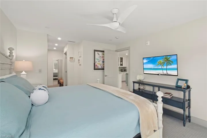 Bedroom with carpet, ceiling fan, and recessed lighting