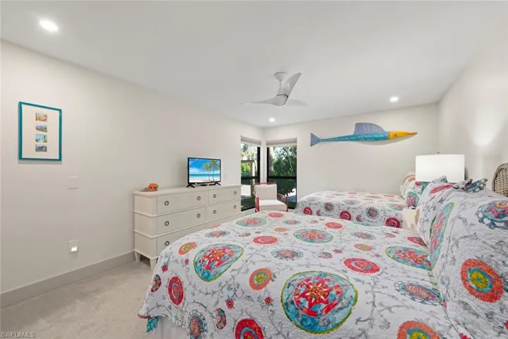 Bedroom with ceiling fan, light colored carpet, and recessed lighting