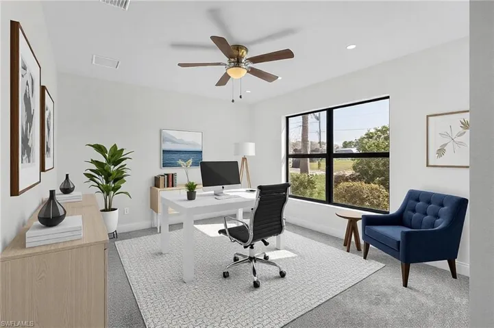 Office space featuring carpet floors and ceiling fan