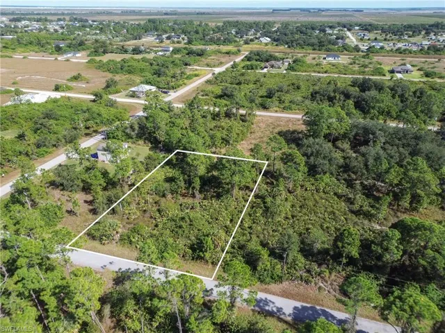 Aerial view of property's location featuring property parcel outlined