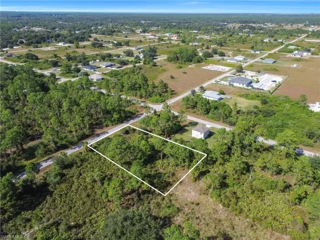 Aerial overview of property's location featuring property boundaries highlighted