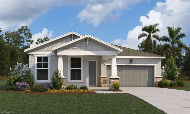 View of front facade with a porch, a front yard, and driveway
