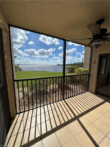 Balcony with ceiling fan and a water view