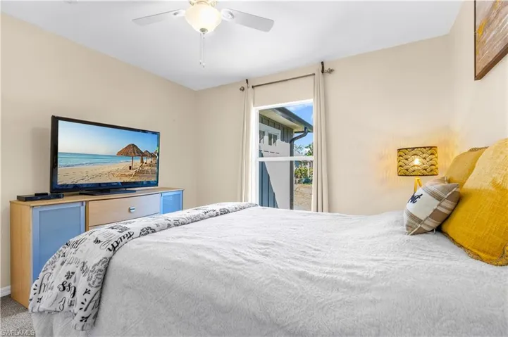 Bedroom with carpet and ceiling fan