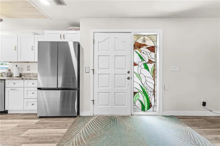 New kitchen cabinets, appliances, vinyl flooring