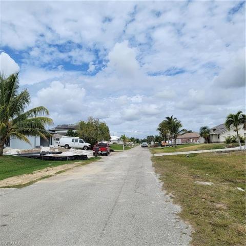 Standing in front of the lot looking down the street where a couple of homes are being built.