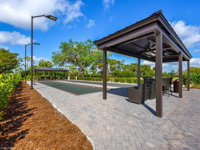 Surrounding community featuring a patio and a bocce ball area