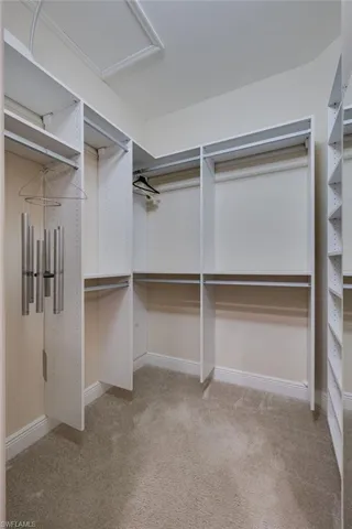walk-in closet with custom built-ins