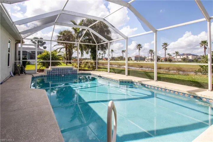 View of pool with a lanai